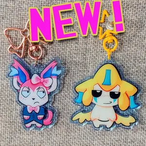 STARTERS movieunleashers keychains Double sided: Jirachi, Dr. Sylveon