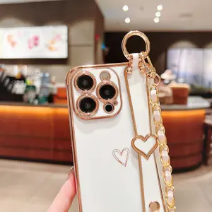 Suitable for iPhone 17 Pro Max electroplated hollow heart phone case 16PM women's diagonal wrist strap 15 shockproof case 11