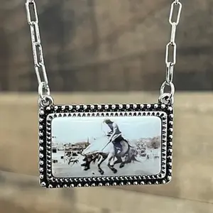 Vintage Cowboy Portrait Necklace with Detailed Horse and Rider Design on Silver Chain