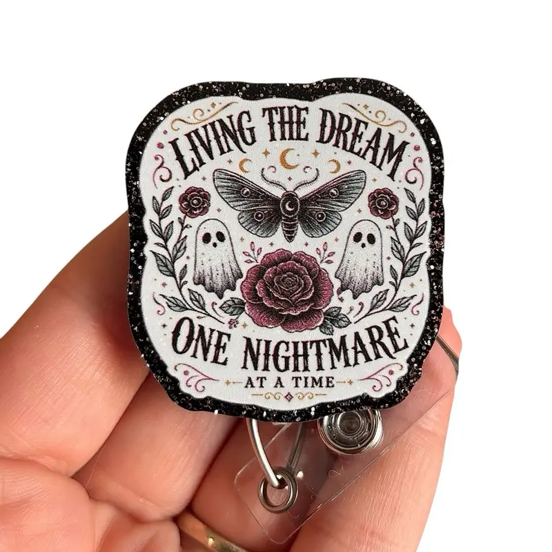 Glitter My Badge Halloween ghost living the dream one nightmare at a time badge reel for nurse and hospital workers. Badge clip Badge pull - Retractable swivel clip with a 360 rotation. Great gift for nurse or healthcare workers.