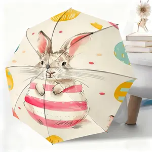 This waterproof folding umbrella features an Easter egg bunny illustration design, suitable for both men and women, and is portable for travel and everyday use.