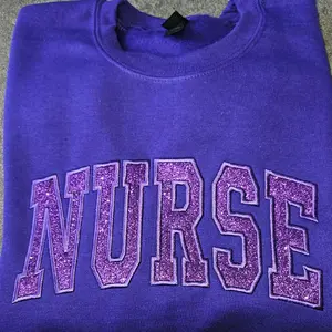 Nurse purple on purple glitter sweatshirt
