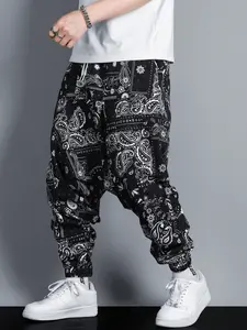 Men’s casual bottoms: Paisley-pattern printed harem joggers; black-and-white paisley street-style pants—an essential men’s fashion piece for going out.