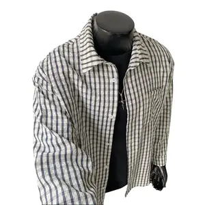 Spring black-and-white pinstriped shirt with contrast piping and a notched collar; loose-fit white casual shirt jacket