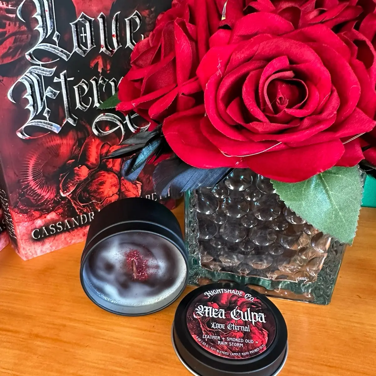 Mea Culpa 4 oz candle in black tin from Love Eternal by Cassandra Elizzabeth. Crackling wooden wick. Woodsy yet fresh.