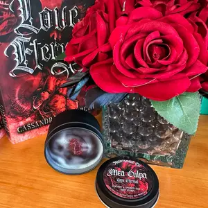 Mea Culpa 4 oz candle in black tin from Love Eternal by Cassandra Elizzabeth. Crackling wooden wick. Woodsy yet fresh.