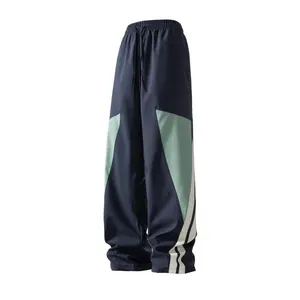 Men's colorblock geometric patchwork casual pants, street style, high-elastic drawstring waist comfortable and non-restrictive, geometric color blocks + side white stripes enhance design sense, draped fabric creates a lazy wide-leg layered look, slimming