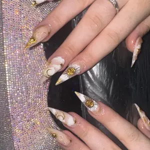 Stiletto Sun and Moon Nails with Gold Flakes - Elegant Design for Any Occasion