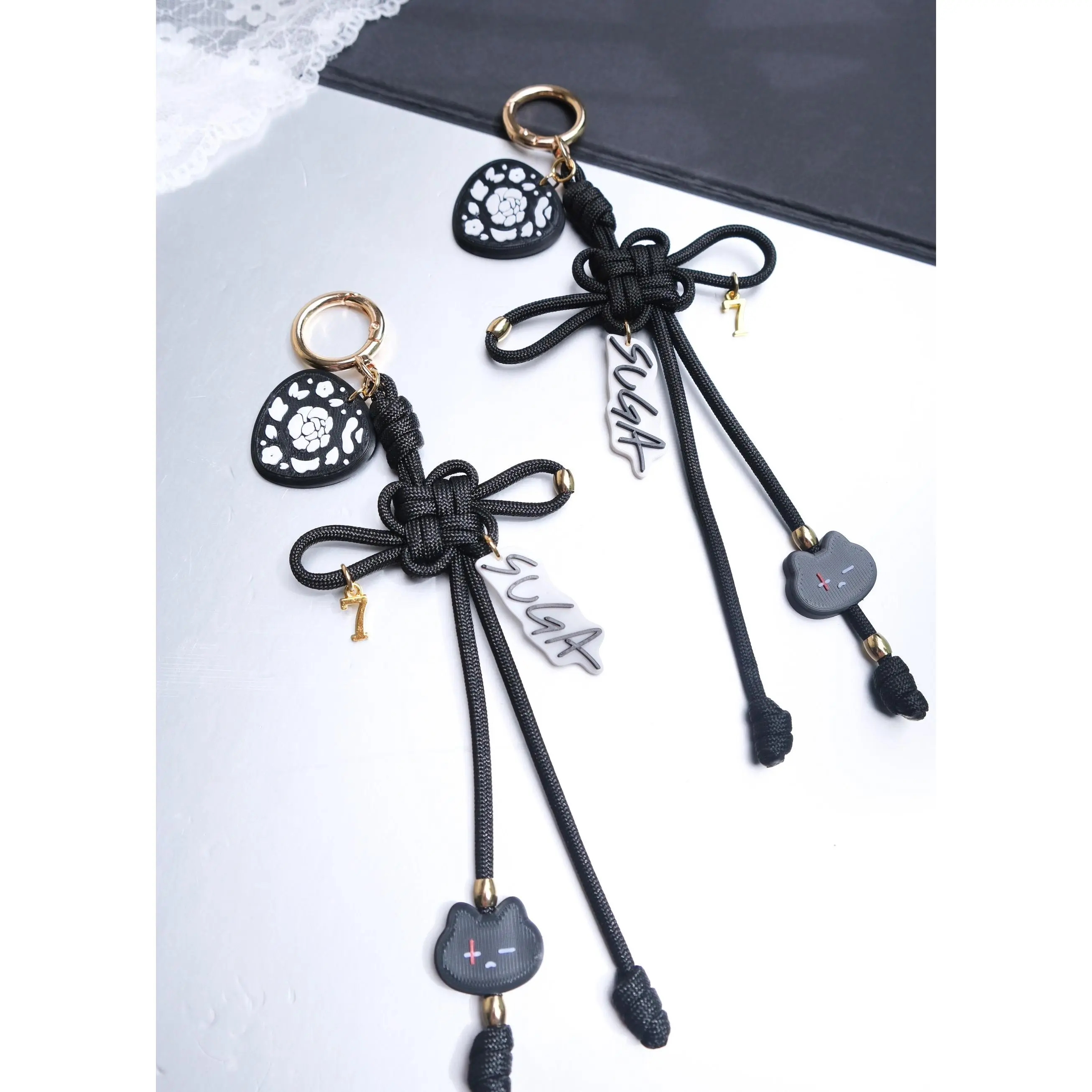 Suga Lucky Knot Keychain With Charms