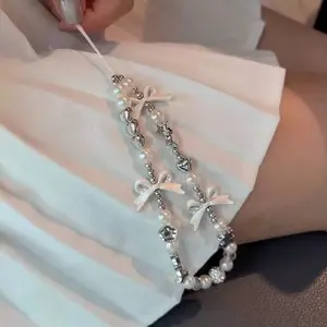 Silver white bow mobile phone chain, handmade bead string hanging chain, wrist hanging rope, camera hanging accessory, high-end pendant, women's chain, Phone Charms, Phone Lanyard