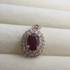 <PingEast jewelry > Ruby pendant Delicate sunburst pendant crafted in 925 sterling silver with double-layer 18K rose gold plating, featuring a 4×6mm natural Burmese ruby. Includes certificate of authenticity