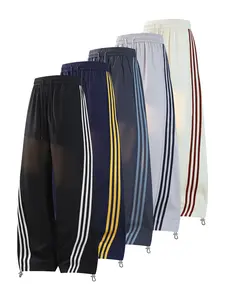 CCCMAI Men's color-block side stripe sports pants, all-season men's casual fashion trendy straight-leg pants with drawstring waistband, classic menswear sweatpants, loose casual pants, stylish activewear for men. Striped