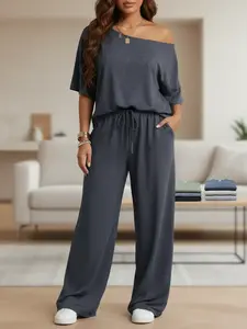 Women’s two-piece set available in multiple colors: relaxed off-shoulder short-sleeve top with one-shoulder design and wide-leg pants; skin-friendly, highly elastic knit fabric with a soft, fluffy feel in gray linen tones. Casual two-piece set for spring/