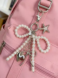 Sweet Pearl Bowknot Silver Color Heart Pendant Car Keychain, Elegant Jewelry Accessory, Perfect Gift for Her, Stylish and Unique Design