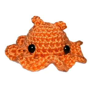 Mini Crochet Dumbo Octopus - Salmon colored with safety eyes decor