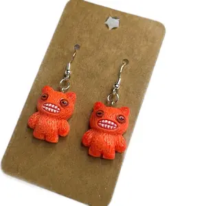Fuggler Orange Monster Earrings with Expressive Eyes and Grinning Mouth Design for Unique Style