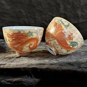 Imperial Porcelain — Dragon & Phoenix Auspicious Design | Silk-textured enamel ceramic tea set featuring gold dragon and phoenix motifs; one pot yields two cups; high-temperature underglaze decoration; trendy Chinese gongfu tea ware; collectible gift box—