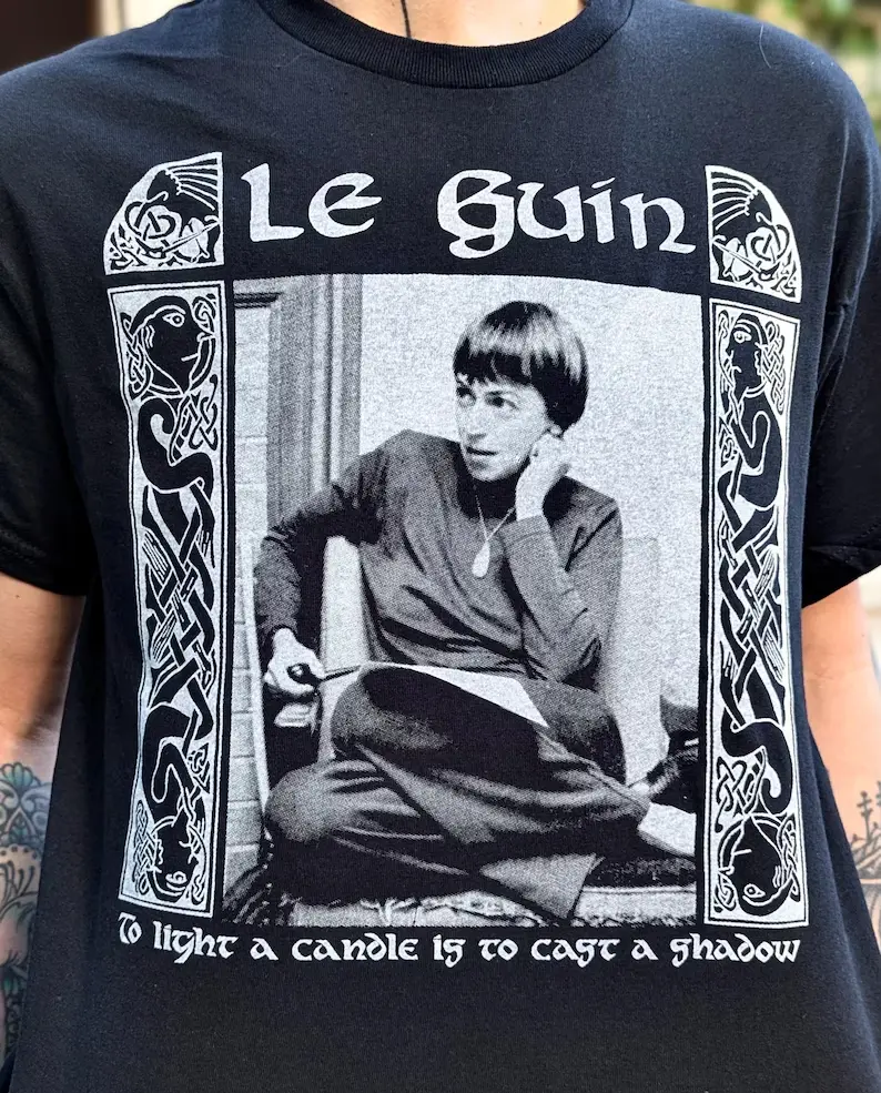 Ursula K Le Guin Comfort Colors T-Shirt, To Light a Candle Is to Cast a Shadow Quote Graphic Tee, Vintage Literary Author Shirt, Retro Washed Book Lover Tee, Writer Reader Gift