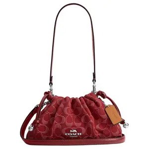 COACH Faye 26 Detachable Strap Drawstring Magnetic Closure Crossbody Bag for Women in Red Denim and Leather