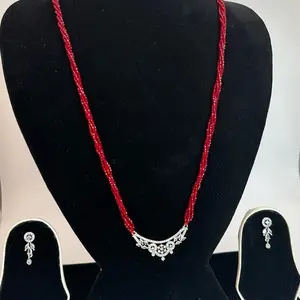 Red hydro potey long sized Nepali Mangalsutra with earrings.