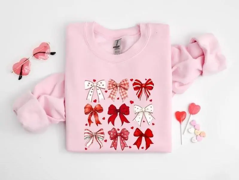 [Sale Up To 50%] Coquette Valentine Heart Bow Sweatshirt, Retro Valentine Shirt, Valentines day Bow Shirt, Coquette Bow Shirt, Bow Valentine Gifts, streetwear graphic tee