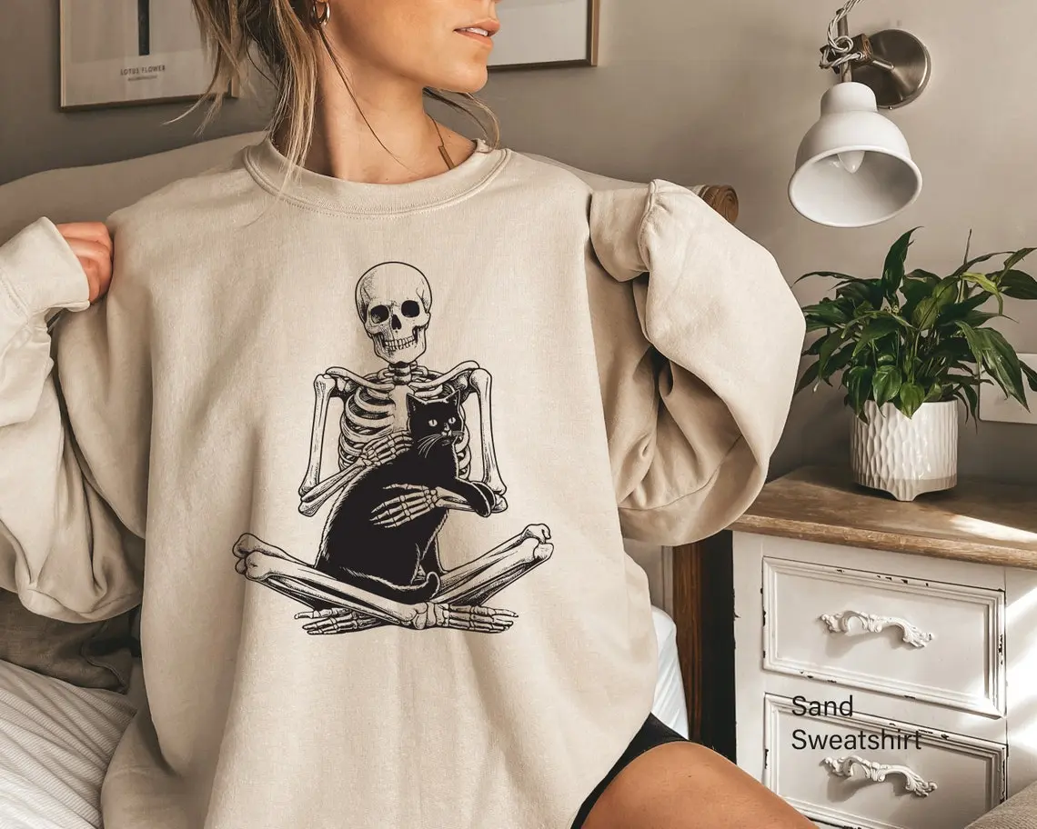 Gildan Women's Skeleton Cat Graphic Sweatshirt - Oversized Long Sleeve Ribbed Crewneck, Casual Spooky Retro Essential Top, Soft Smooth Cotton-Spandex-Yarn Fabric, Pill Resistant, Machine Washable, Women's Tops