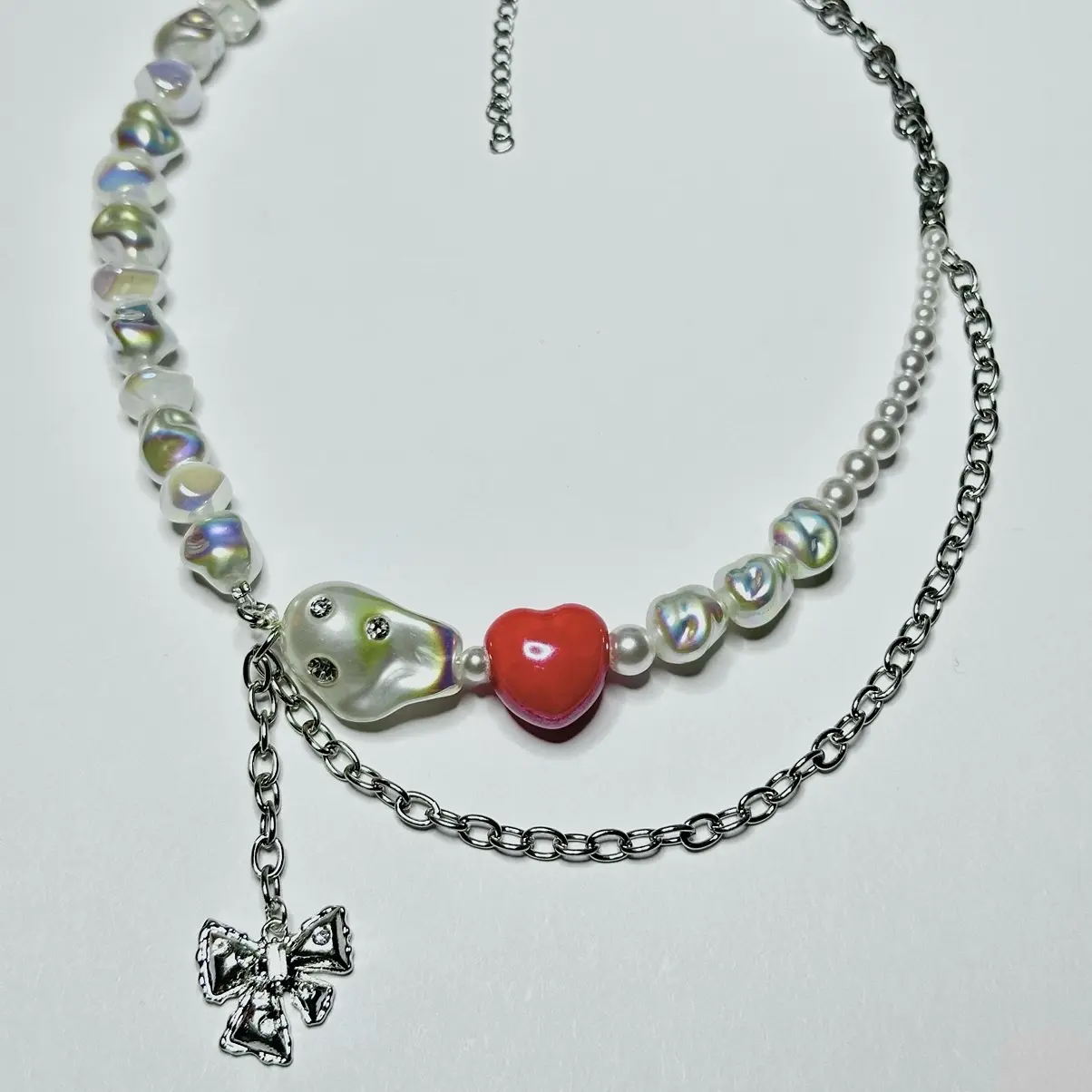 Chain necklace with heart shaped ceramic charm