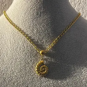 Gold Spiral Shell Necklace with Intricate Design and Durable Chain for Everyday Wear