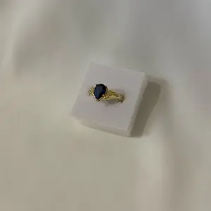 Hand Ring Holding Blue Stone - Elegant Design with Blue Stone, Perfect for Everyday Wear