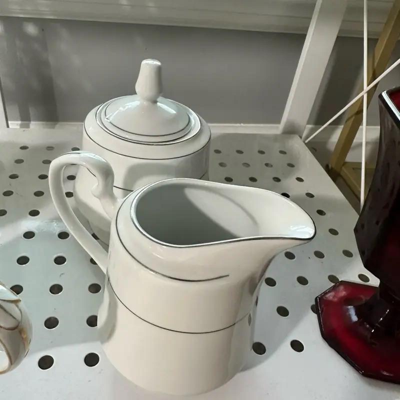 white and silver cream and sugar