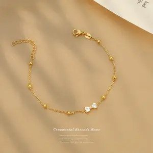 Woman 18K Gold Station Bead CZ Bow Chain Bracelet
