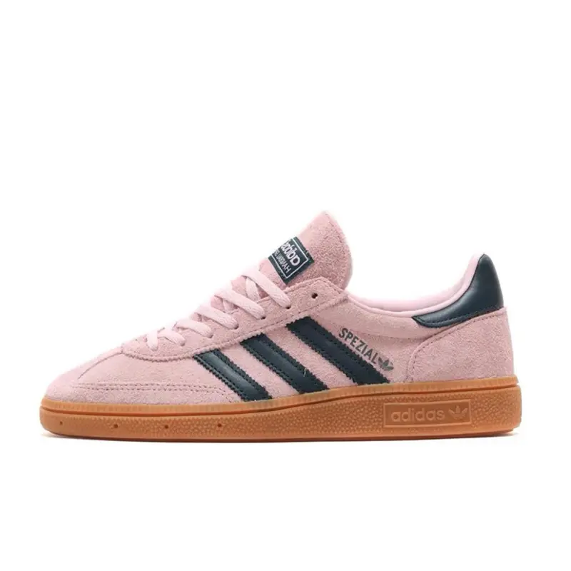Adidas Handball Spezial Clear Pink Arctic Night Women’s Casual Sneakers, Featuring a Classic Retro-Inspired Low-Top Design, Stylish Clear Pink and Arctic Night Colorway, Signature 3-Stripes Detail, Comfortable Fit, and Versatile Everyday Appeal