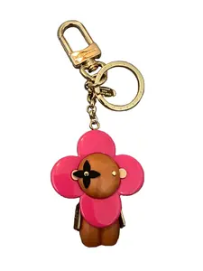 Pre-owned Louis Vuitton resin and wood Bag Accessories Vivienne Bag Charm/Keychain