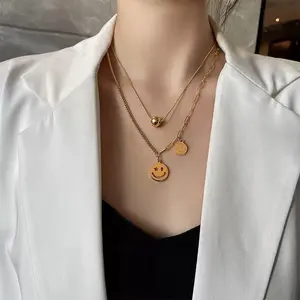 Gold-Tone Layered Necklace with Smiley Face Charm and Beaded Accents for Everyday Wear