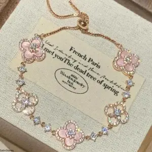 Ladies' Romantic Rose Gold Four-Leaf Clover Bracelet with Sparkling Crystals Hypoallergenic Fashion Accessory for Daily Wear and Dates skin-friendly design