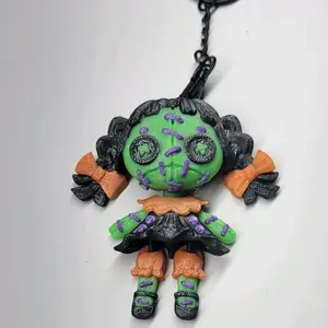 Creepy Doll Keychain Charm 3D Printed with Glow Feature Unique Spooky Design Perfect for Collectors and Home Decor