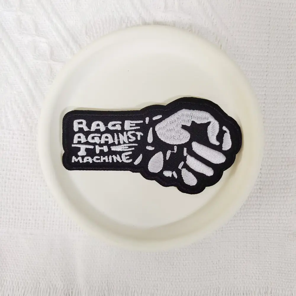 1PCS rock music style embroidery patch, Embroidered Patches, Lettered Embroidery, with Rage Against the Aachine lettering and white fist pattern design, suitable for clothing, bags, material with hot melt adhesive that can be sewn, ironed, and washed