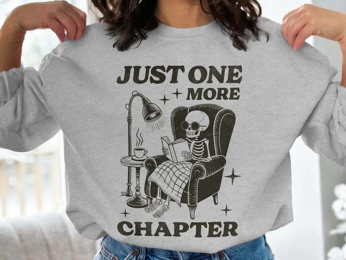 Gildan Women's Skeleton Reading Long-Sleeve Sweatshirt - Women's Clothes, Ribbed Round Neck, Spandex-Yarn Smooth Fitted Cotton Top, Dress-Inspired for Halloween & Cozy Season Book Lovers, Available in 3XL