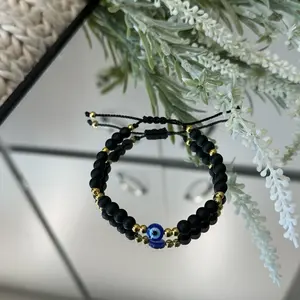 Adjustable Evil Eye Bracelet with Black Beads and Blue Element, Adjustable Design, Unique Bead Arrangement