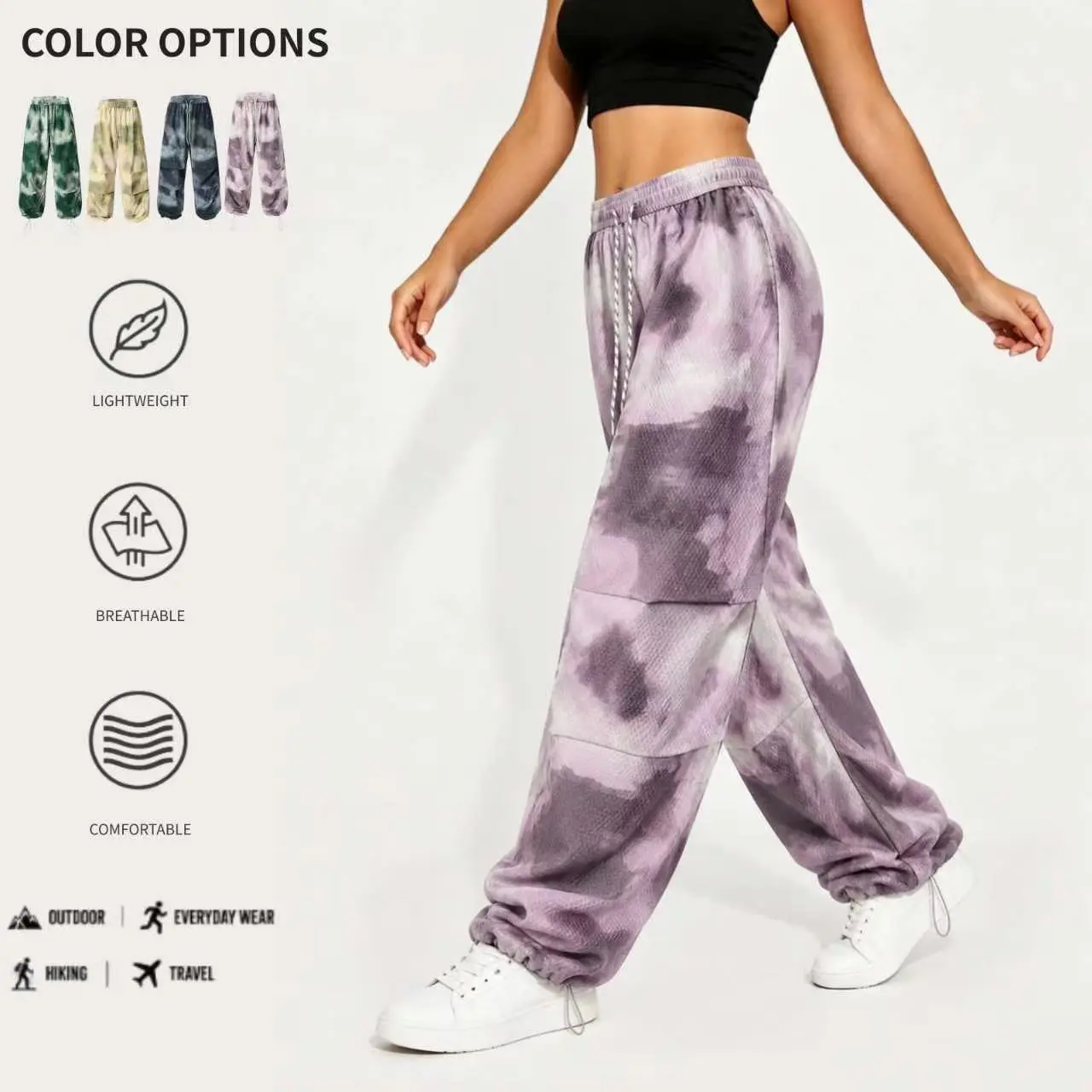 Women's streetwear-style wide-leg casual pants featuring a tie-dye/batik print, woven fabric, drawstring waist, and adjustable cuffs; long length.