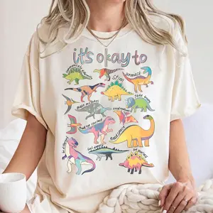 Comfort Colors It’s Ok To Be Different Autism Dinosaur T-Shirt – Autism Awareness Design, Autism Mom Gift, Special Education Teacher Style, Streetwear Style Unisex Fits Cotton Comfort Casual Shirt With Positive Inclusive Aesthetic