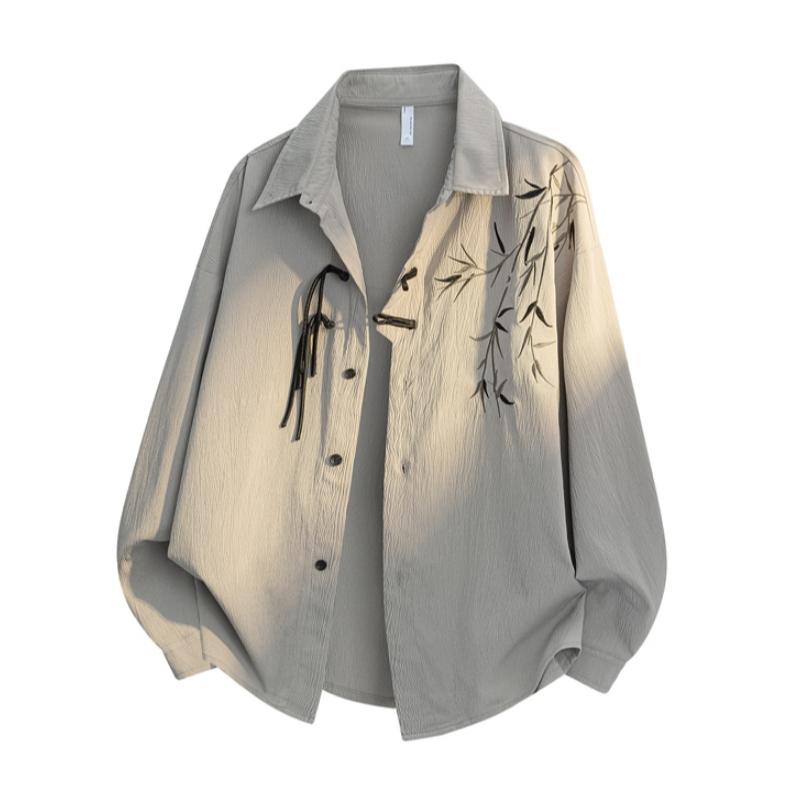 New Chinese-style long-sleeve top featuring bamboo leaf embroidery, a loose fit, frog buttons, design-forward retro high-end feel, and a drapey silhouette—a relaxed casual top with premium quality.
