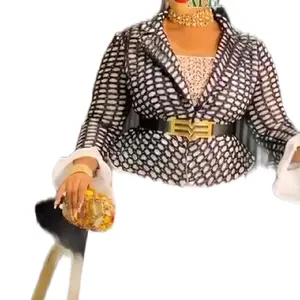 White and Black Scuba Dress with Gold Buckle Belt and Elegant Design