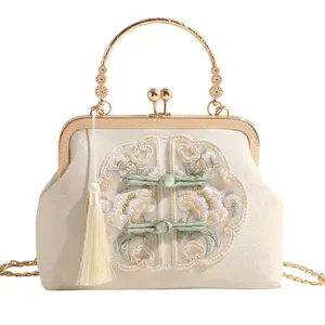 Women’s handbag in modern Chinese style with frog buttons and embroidery, new spring design, pairs well with a Maoman skirt; Hanfu-inspired bag.