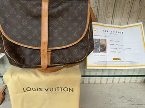 Pre-owned Louis Vuitton canvas & vachetta Messenger Bags Samur 35 Messenger Bag in Brown Monogram Canvas with Brass Hardware Finish