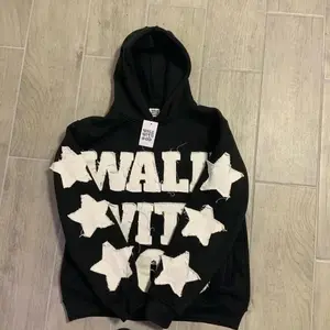 Y2K retro black street-style hoodie with letter appliqué, vintage urban fashion look #star patch sweatshirt #distressed style #hip-hop fashion Mother’s Day and Easter gift