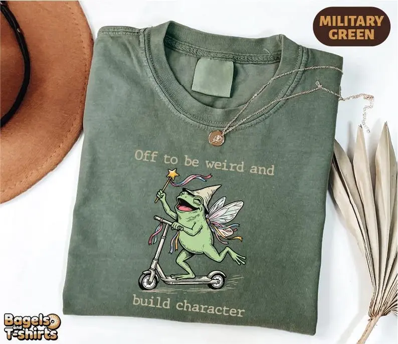 Comfort Colors Off to Be Weird and Build Character Shirt, Funny Frog Scooter Tee, Cottagecore Fairy Frog Graphic T-Shirt, Whimsical Goblincore Gift