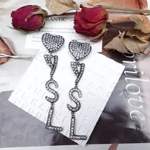 Pre-owned Saint Laurent Crystal Silver Letter Earrings T10249407