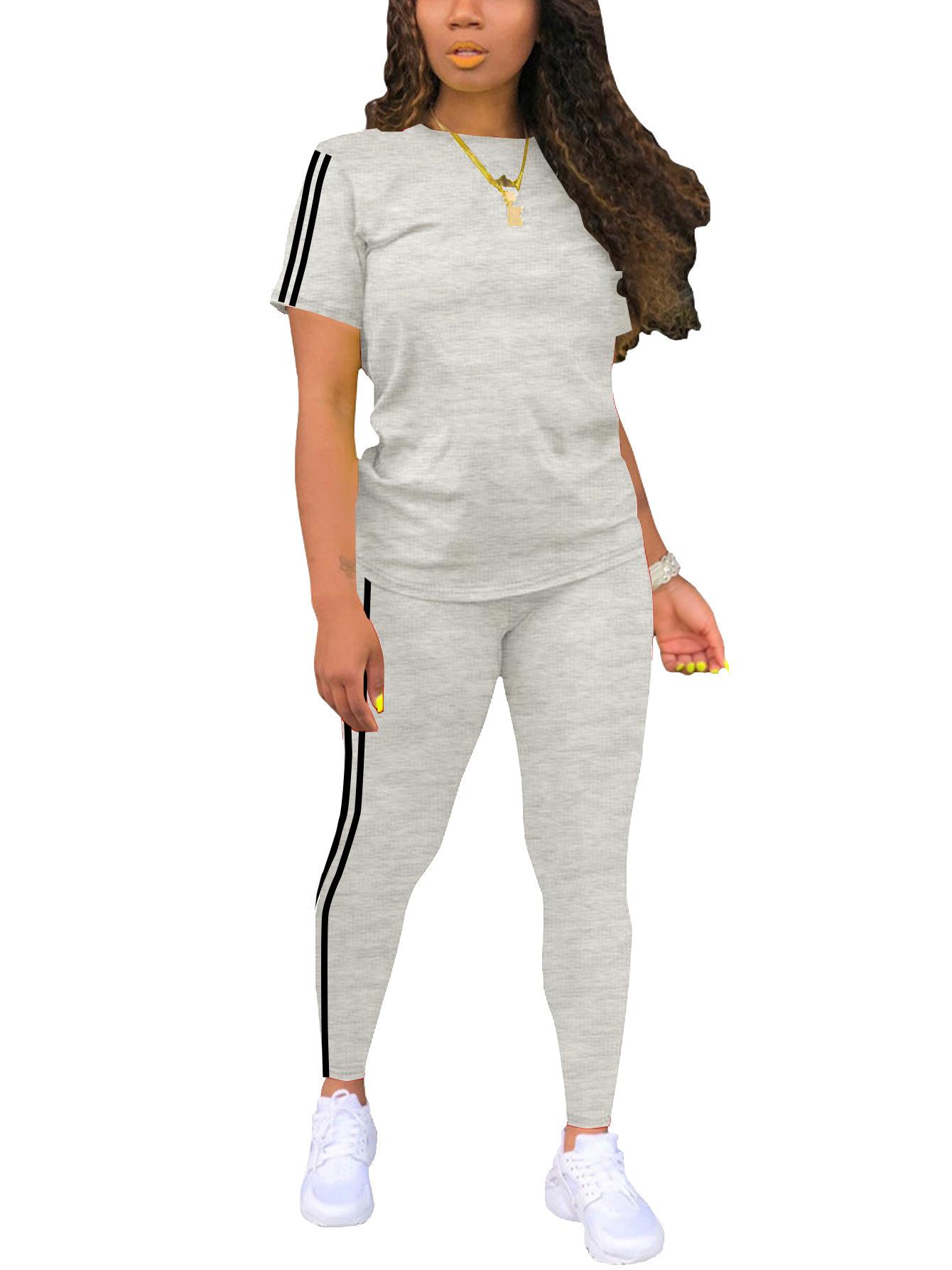 Women’s athletic fitness striped set: short-sleeve top with white side stripes + high-waisted leggings, slim fit that flatters the figure, two-piece set