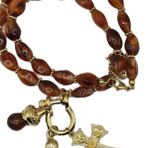 Elegant Brown Beaded Necklace with Gold Cross Charm and Detailed Gold Accents for Women